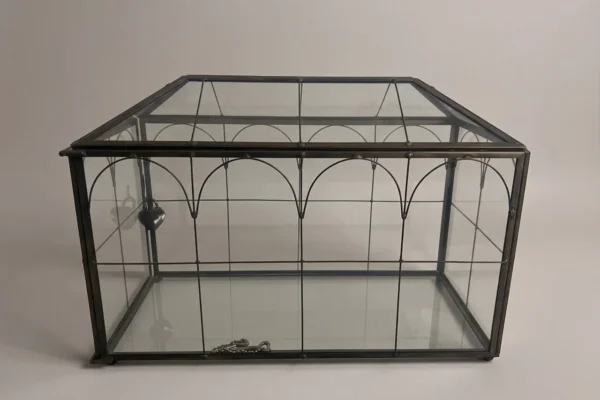 Black-framed glass card box with heart-shaped lock for wedding reception