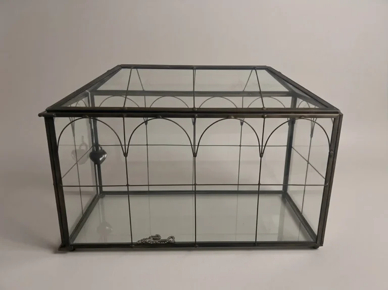 Black-framed glass card box with heart-shaped lock for wedding reception