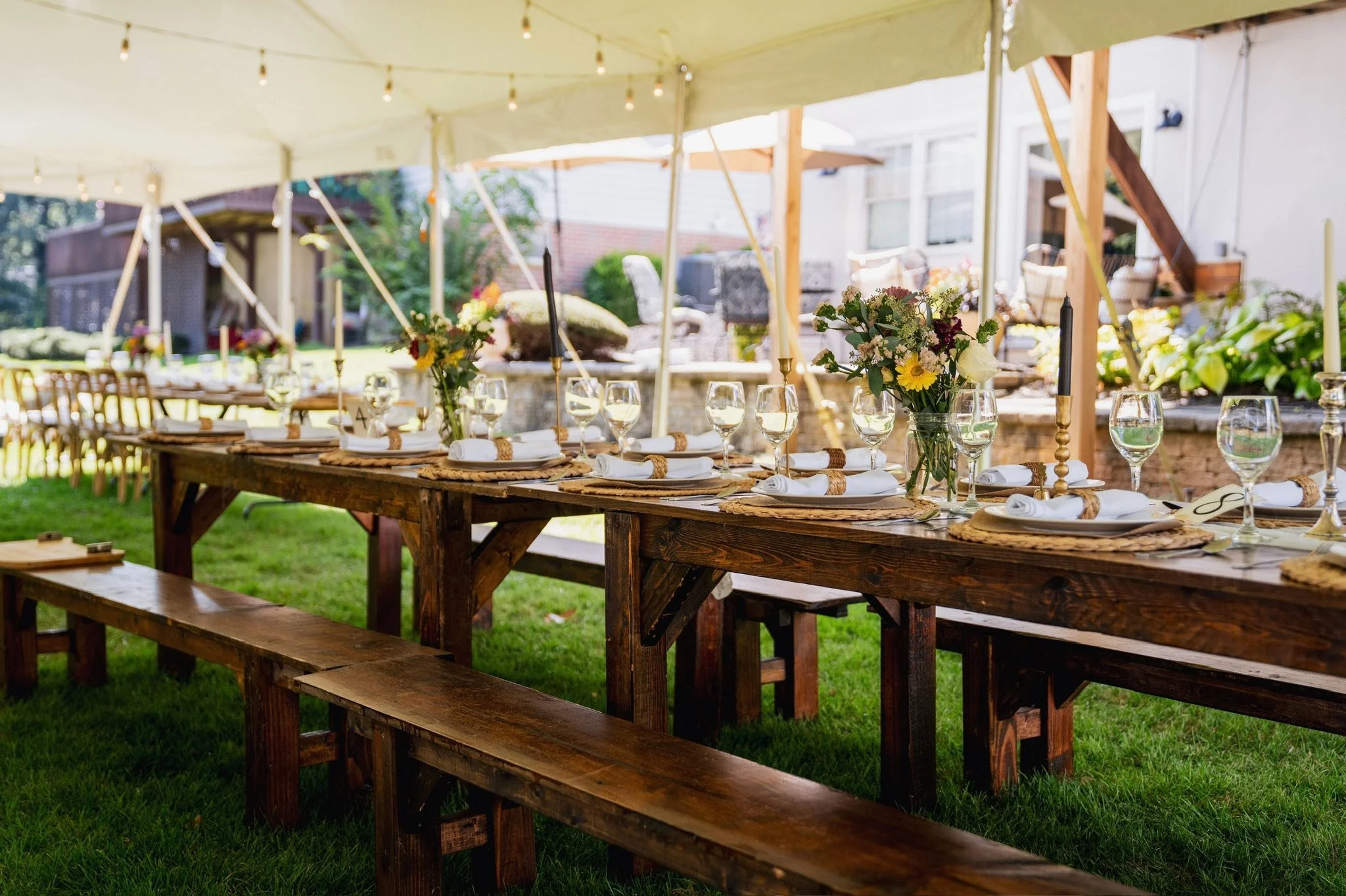 Wooden Benches Under Tent at Wedding Ceremony