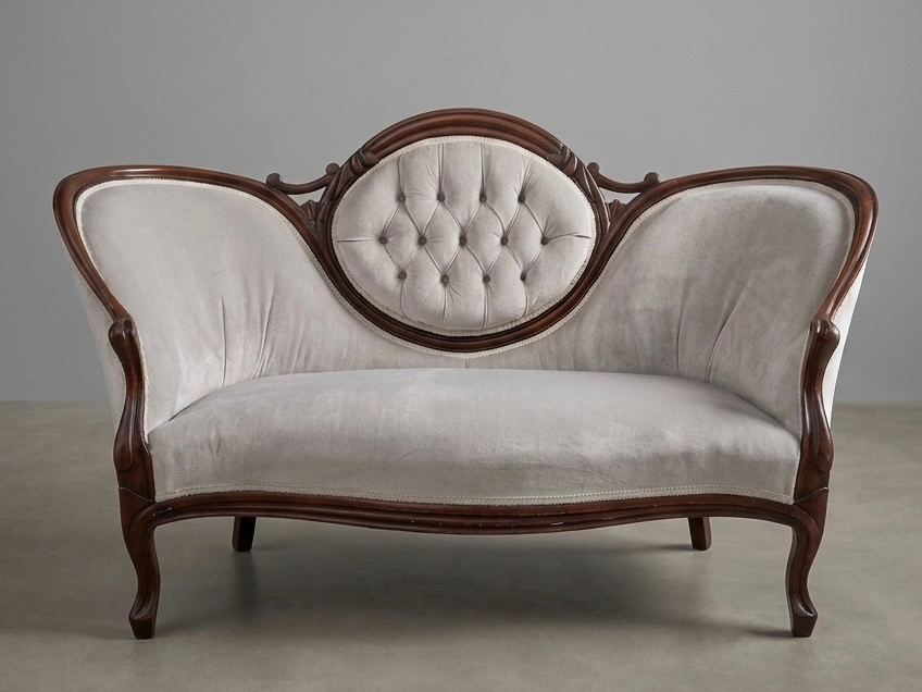 Vintage tufted velvet couch with carved wood frame