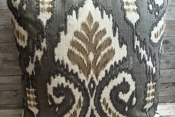 Charcoal ivory and taupe ikat pattern rental pillow