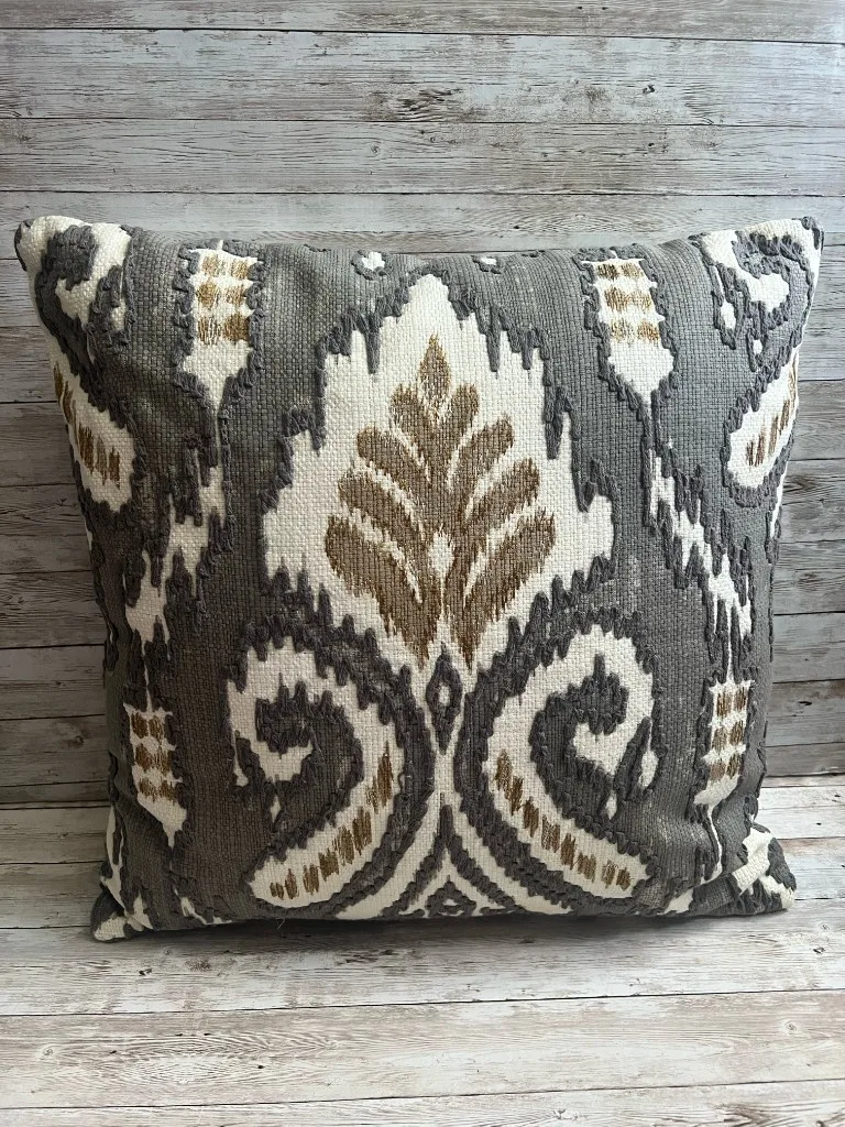 Charcoal ivory and taupe ikat pattern rental pillow