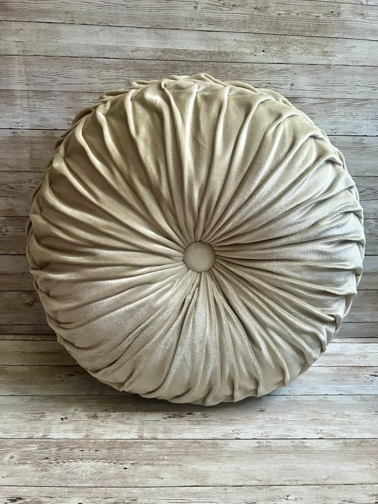 Ivory pleated round velvet rental pillow