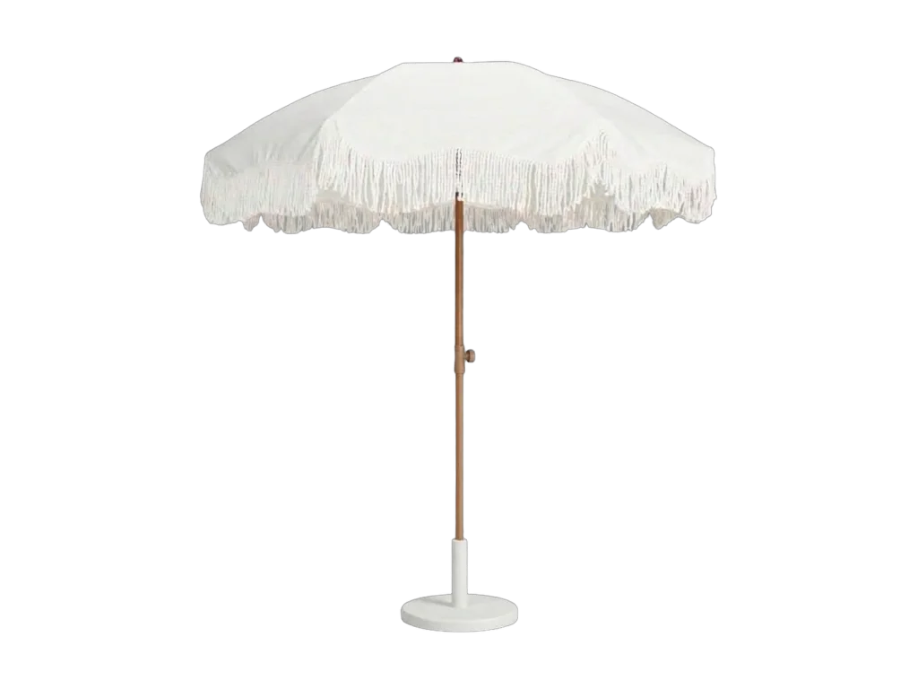 White fringe patio umbrella with base rental catalog cutout
